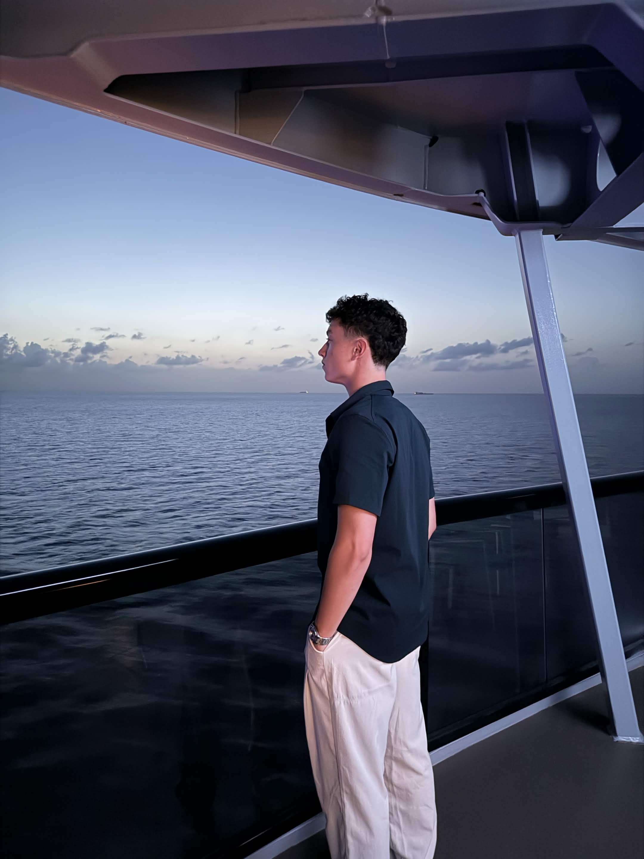 Joe Brennan on a balcony at dusk
